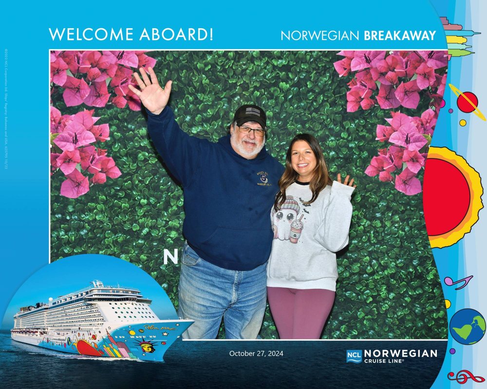 Dad and me waving in our welcome aboard photo on the Norwegian Breakaway